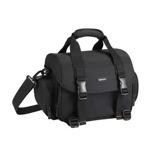 Produktbild: Amazon Basics Schultertasche für SLR-Kamera und Zubehör, Groß, Verstellbarer Gurt, Wasserdicht, Stoßfest, Einfarbig, Gepolstert - Schwarz/Orange