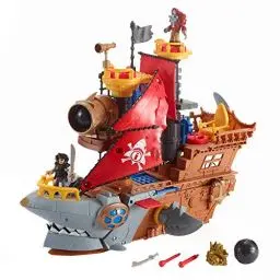Produktbild: Fisher-Price IMAGINEXT Haimaul-Piratenschiff - bewegliche Flossen, Power Pad für Geheimschatz Enthüllung, Kanonen, Gefangenenbereich, Geheimversteck und Piratenfiguren, DHH61