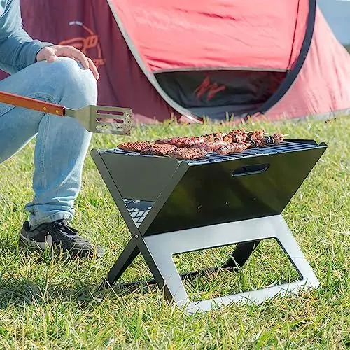 Produktbild: InnovaGoods® Faltbarer tragbarer Holzkohlegrill Foldyq, traditionelles und gesundes Kochen Ihrer Lebensmittel, aus Stahlmaterial, ideal für Zuhause und Garten.