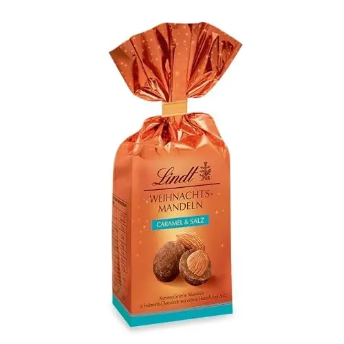 Produktbild: Lindt Schokolade Weihnachts-Mandeln Caramel & Salz | 100 g Beutel | Mandeln in Vollmilch Schokolade mit einem Hauch von Salz sowie Zimt und Koriander | Schokoladen-Geschenk zu Weihnachten