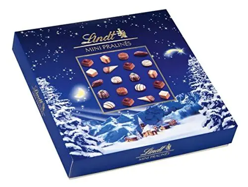Produktbild: Lindt Schokolade Weihnachts-Zauber Mini Pralinés | 100g | 20 weihnachtliche Pralinen in 9 Sorten, zum Teil alkoholhaltig | Schokoladen-Geschenk zu Weihnachten | Pralinen-Geschenk