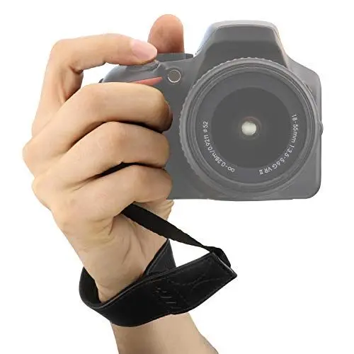 Produktbild: MegaGear Leder Handschlaufe für DSLR SLR Kameras - Handgelenkschlaufe, Sicherer Halt, Universal Kompatibilität - Canon Nikon Sony Olympus Pentax Fujifilm Leica