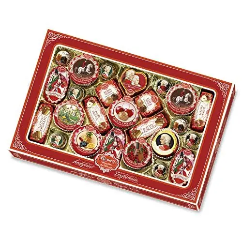 Produktbild: Reber Spezialitäten-Kassette – 25 hochfeine Reber Klassiker – Mit Pralinen, Echten Mozart-Kugeln, Constanze Mozart-Kugeln, Marzipan, Pasteten und Nougat