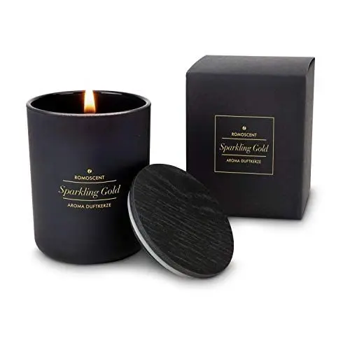Produktbild: Römer Wellness Geschenkartikel: ROMOSCENT Aromakerze Sparkling Gold im edlen, schwarzen Glas mit Holzdeckel·· Duftkerze für Drinnen und Draußen·· Maße: ca. 6 x 6 x 8 cm