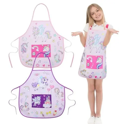 Produktbild: ROSEMO 2 Stück Kochschürze Kinder Einhorn Küchenschürze Mädchen Kinderschürze mit Tasche Werkenschürze Bastelschürze Malschürze Geschenk für Kinder 3-12 Jahre zum Kochen Malen Basteln