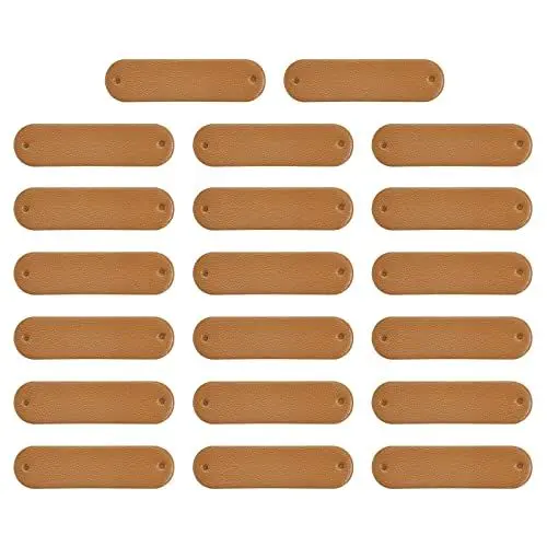 Produktbild: sourcing map 40Stk Handgemacht Leder Label PU Leder Nähen Geprägt Etikett Verzierung Häkeln Etiketten für Kleidung Hut Schals Basteln (45x12mm Braun)