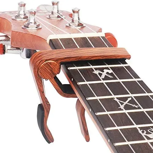Produktbild: WINGO Pro Kapodaster Ukulele Capo für Sopran Contert Bariton, Holzoptik (Metall)