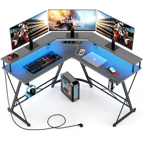 Produktbild: Yornoli Gaming Tisch mit LED, Eckschreibtisch mit Monitorablage, Schreibtisch L Form mit 3 Steckdosen & 2 USB Ladeanschluss, Computertisch Kohlefaser Schwarz